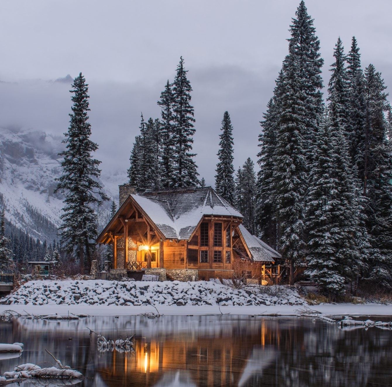 Winter across pond looking at Large cabin