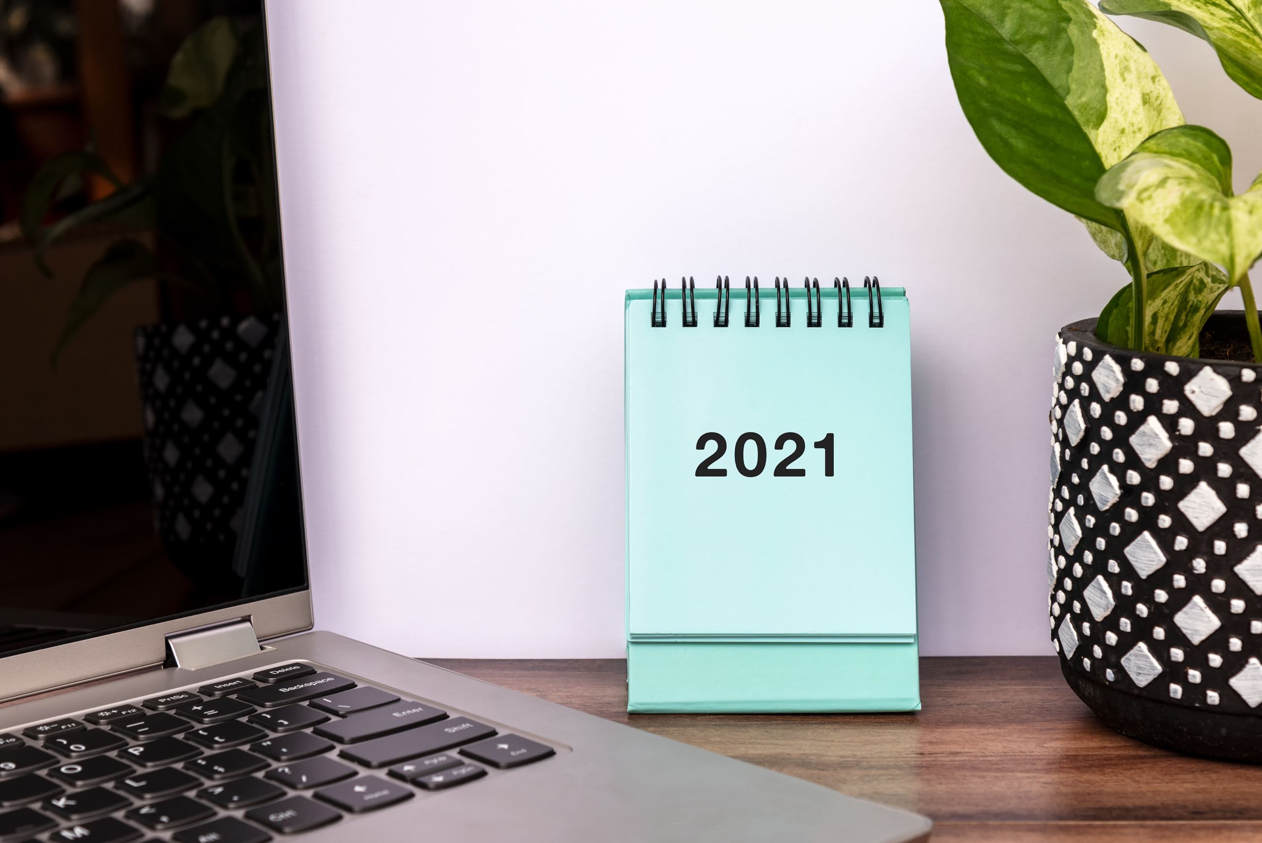 January 2021 teal calendar on desk