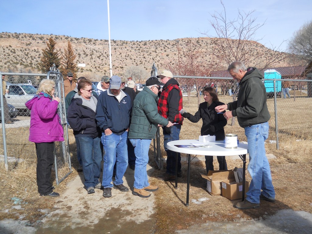 Photo of people entering the rodeo arena for the closing ceremonies of the 2012 Burbot Bash.