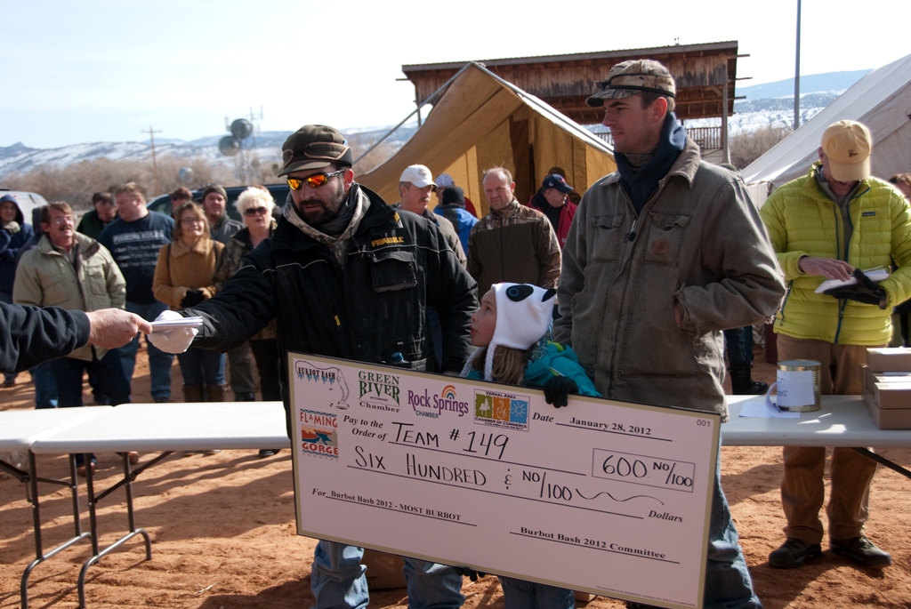 Photo of Team Asay as they are awarded their winnings for the Most Burbot during the 2012 Burbot Bash.