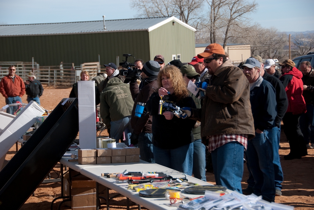Master of Cermonies, Adam Eakle, and event organizer Cindy Keller calling out the next prize winner at the 2012 Burbot Bash closing ceremonies!