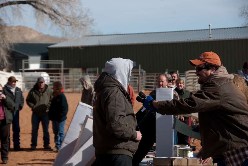 Photo of Master of Ceremonies interviewing a prize winner during the 2012 Burbot Bash Closing Ceremonies.