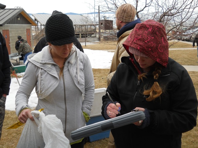 Photo of staff recording burbot information during 2013 Burbot Bash