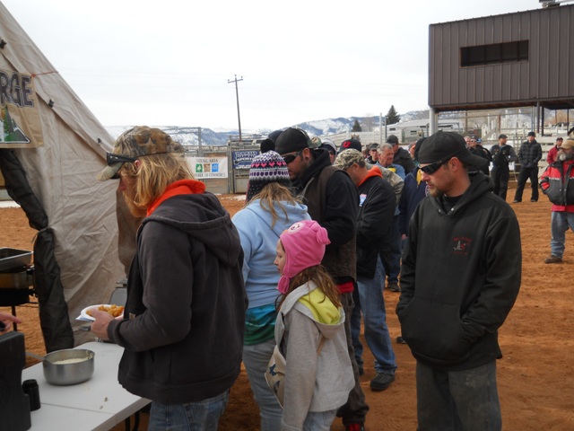 Photo of participants and family members lined up to enjoy samples of burbot prepared by the Flaming Gorge Resort during the closing cermenies of the 2013 Burbot Bash.