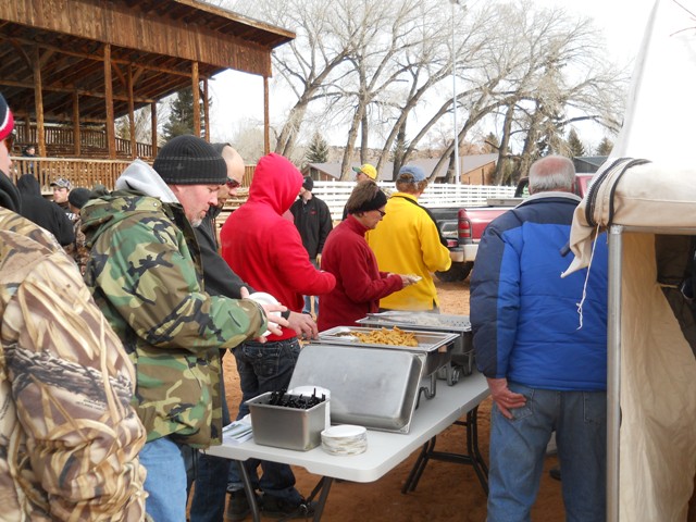 Photo of participants and family members lined up to enjoy samples of burbot prepared by the Flaming Gorge Resort during the 2013 Burbot Bash.