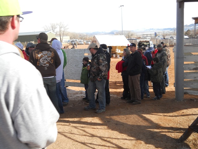 Photo of partial line of winners of various cash prizes during the 2013 Burbot Bash