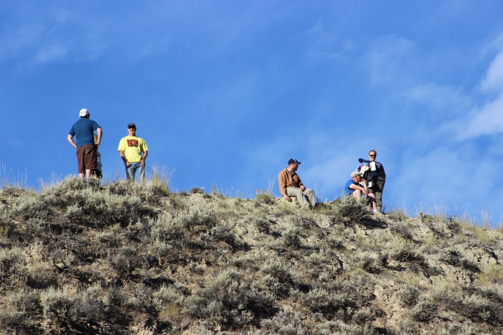 Spectators on a hill watching for the runners