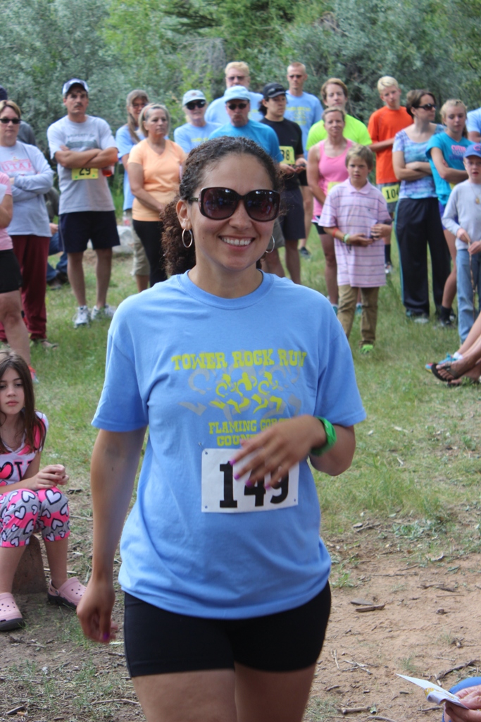 Photo of an age group winner receiving her award for the Tower Rock Run 5k