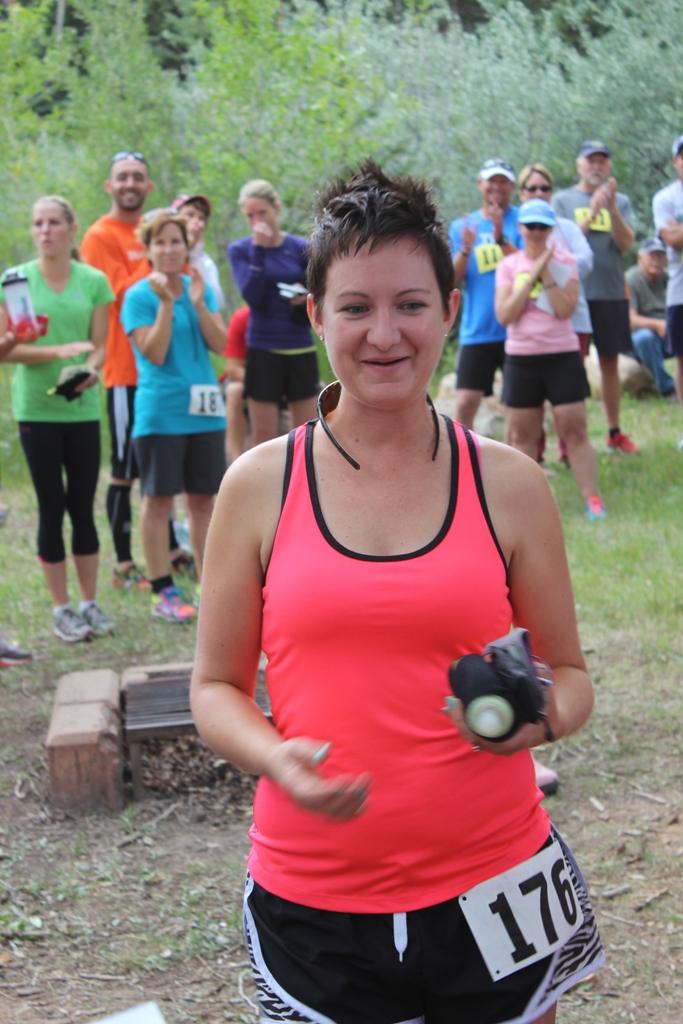 Photo of an age group winner receiving her award for the Tower Rock Run 5k
