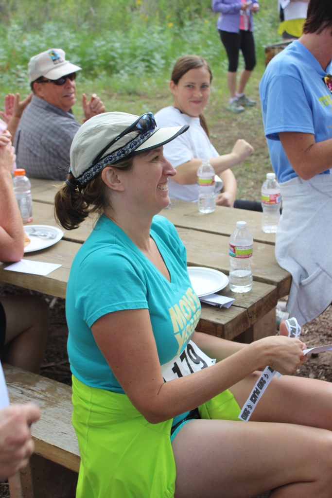 Photo of an age group winner receiving her award for the Tower Rock Run 5k