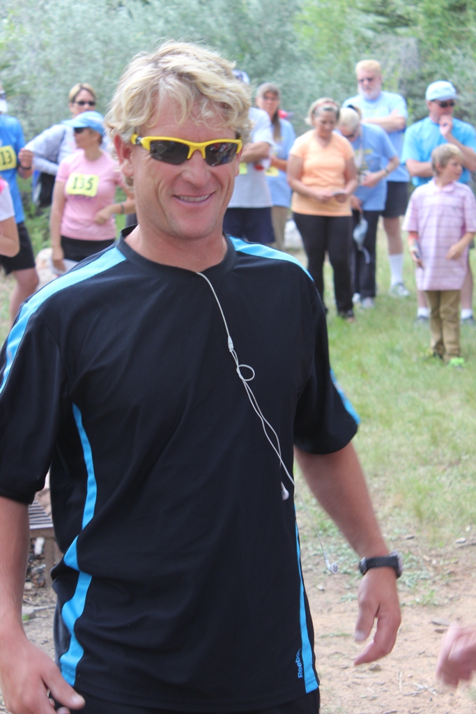 Photo of an age group winner receiving his award for the Tower Rock Run 5k