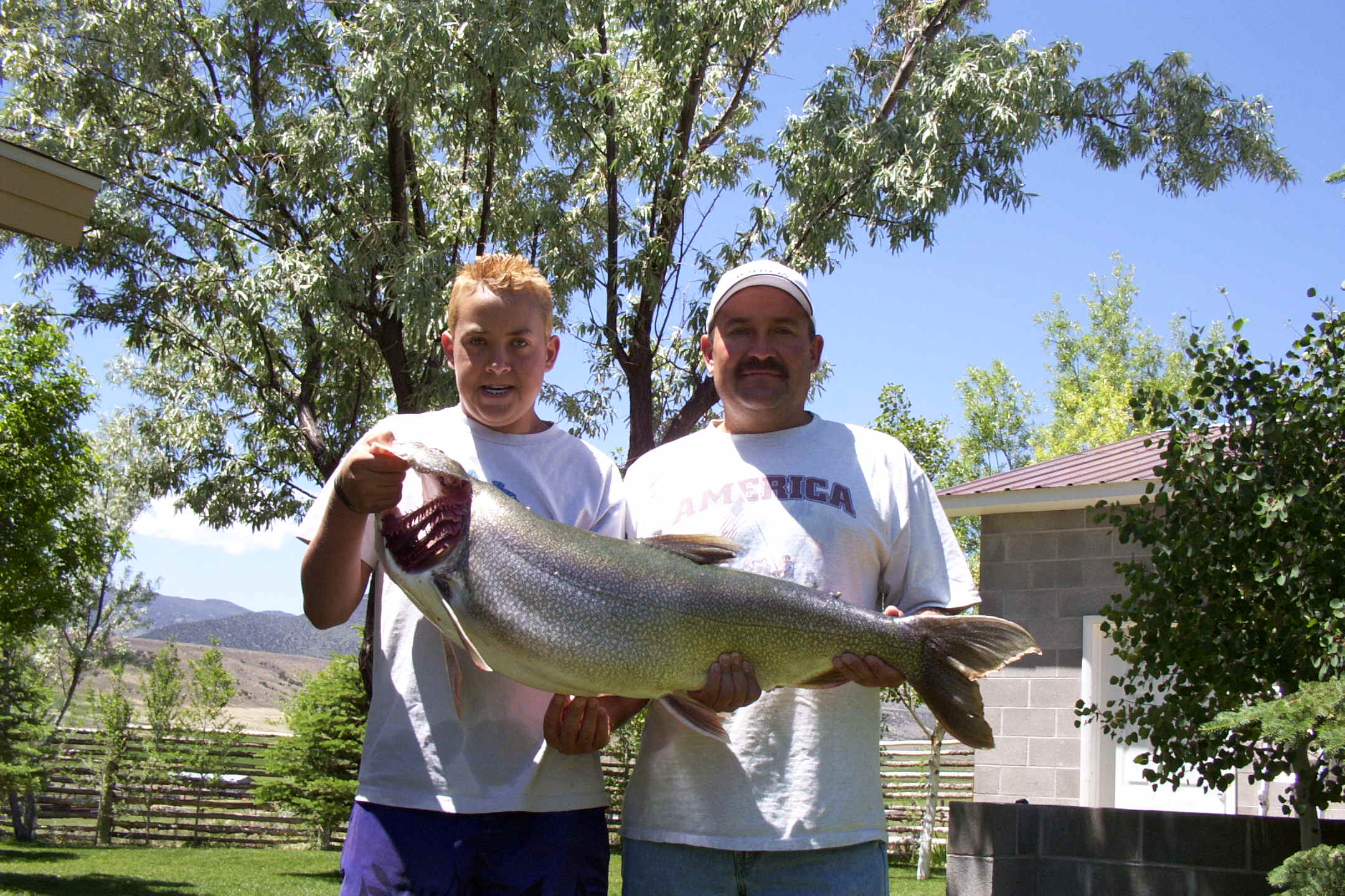 Father and son holding a lage lake trout caught in the Flaming Gorge!
